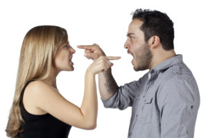 image of a angry couple pointing a finger at each other